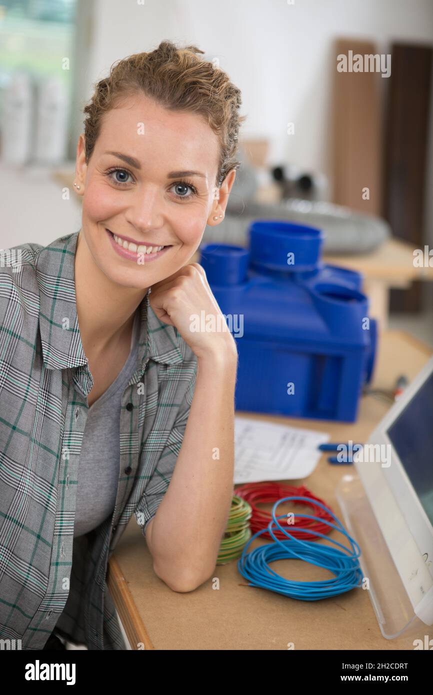 female pc technician smiling at the camera Stock Photo