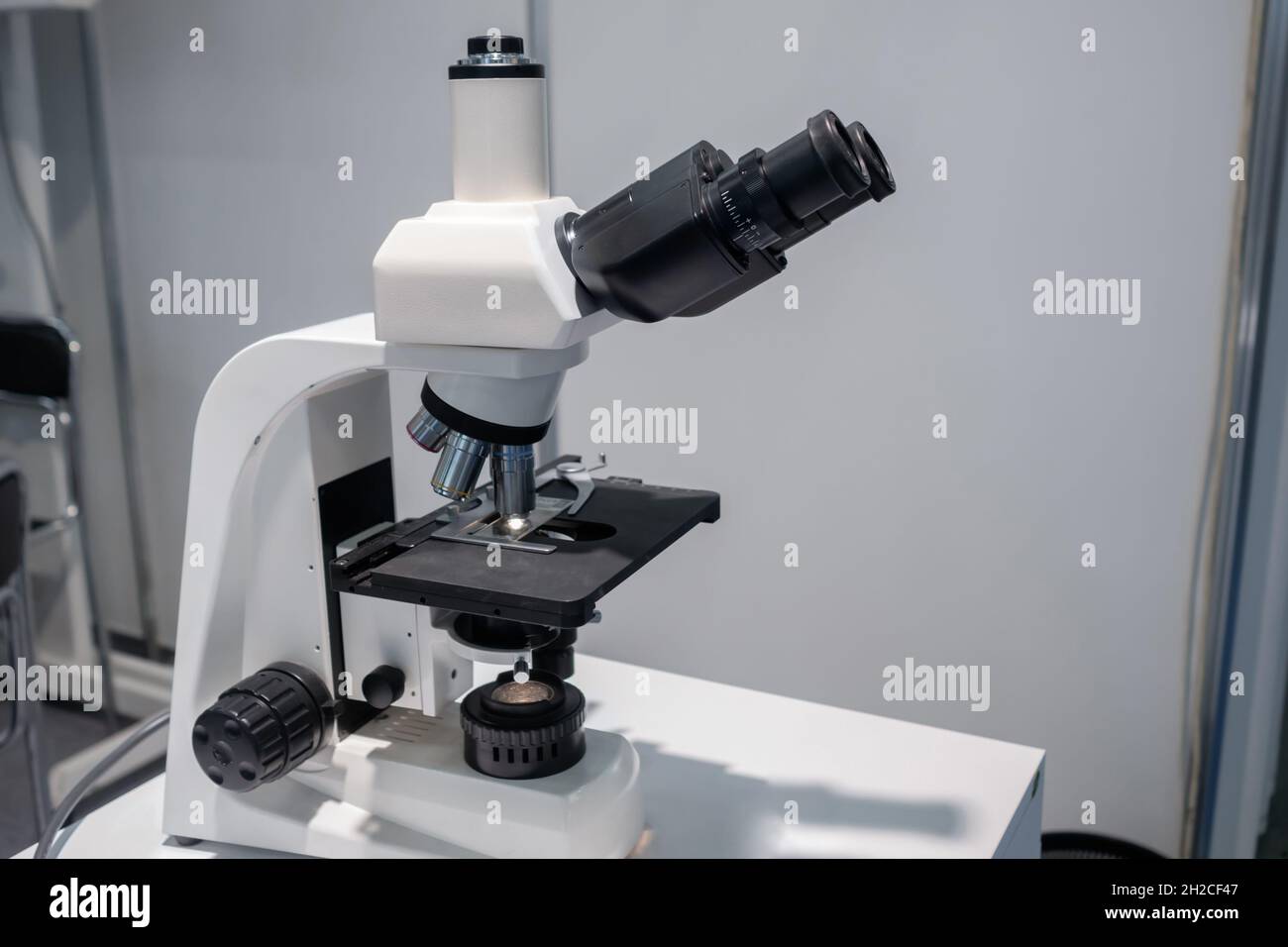 Close up view of laboratory equipment, optical microscope Stock Photo