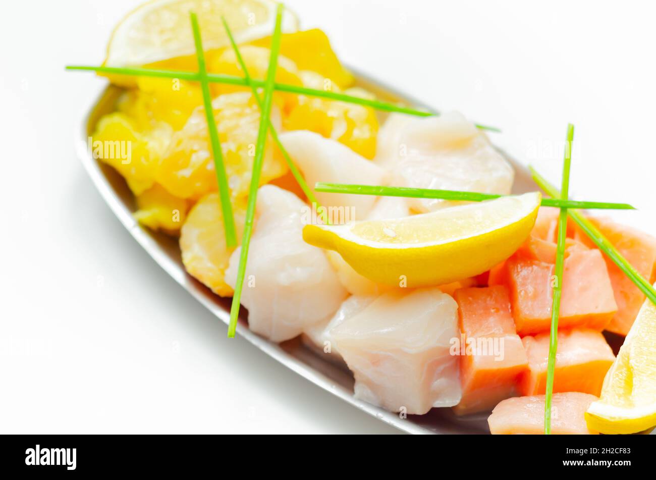 Fish pie mix, defrosted, skinless and boneless cod, dyed smoked haddock