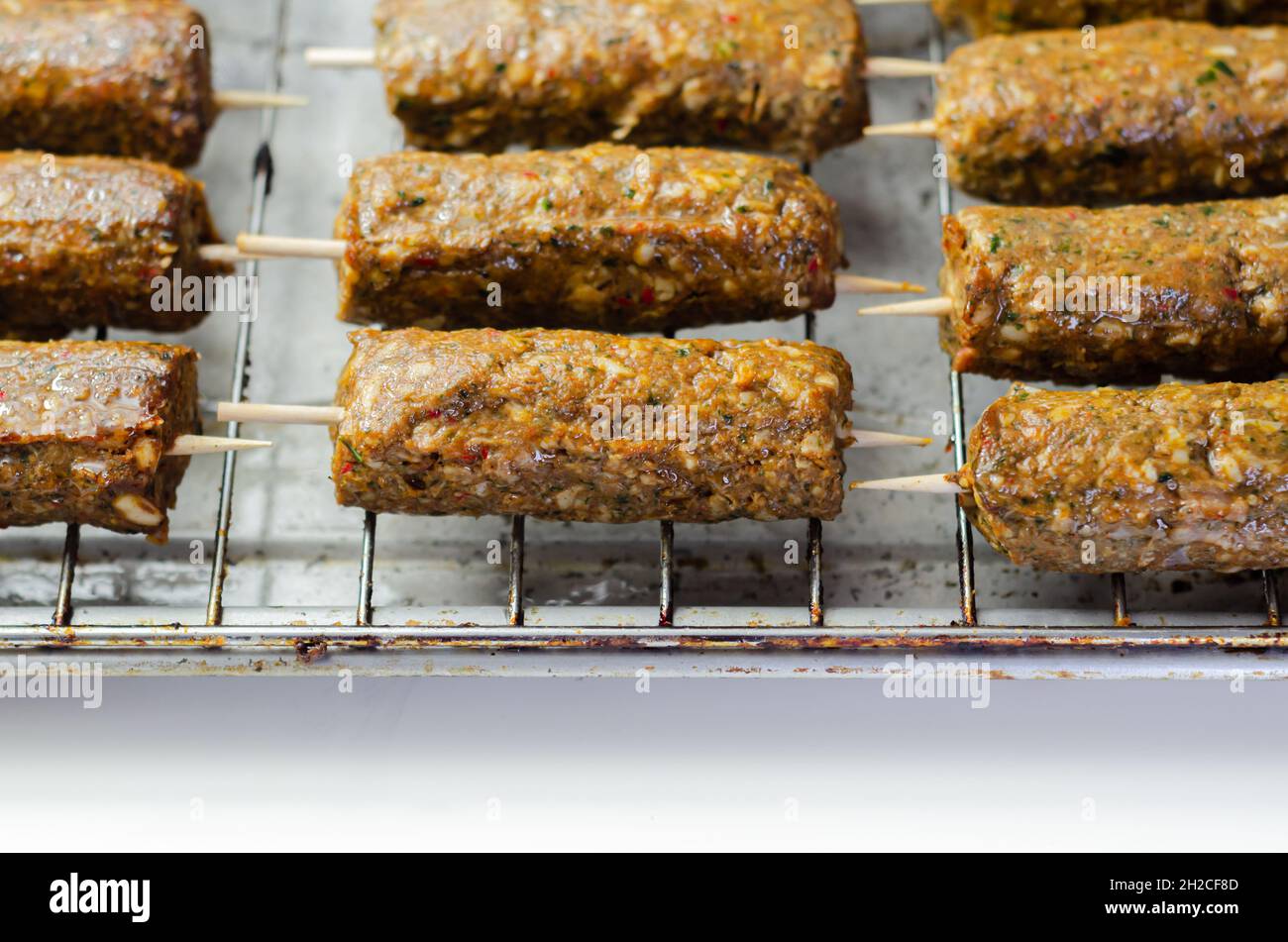 Minced and shaped lamb kebabs with chilli and coriander prepared for grill,  traditional turkish cuisine Stock Photo - Alamy