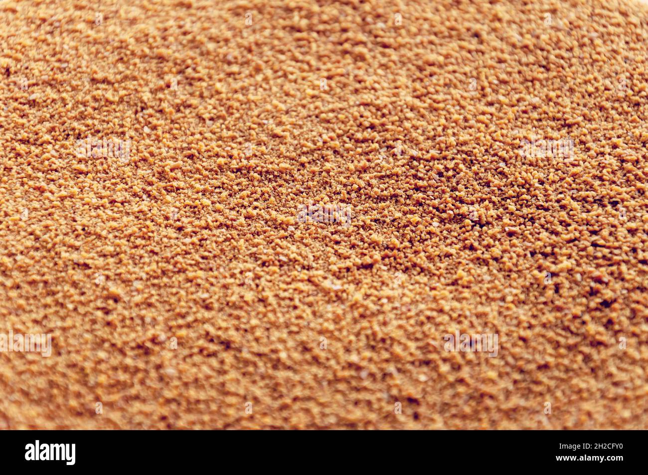 Close up of Biscuit rich golden crumbs. Nice sandy texture of crumbs