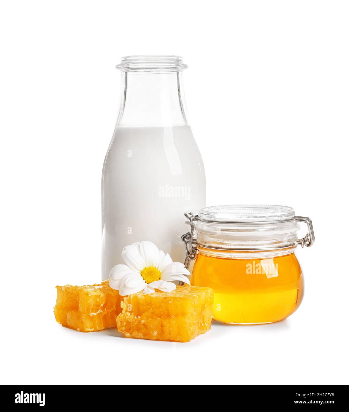 Beautiful composition with milk and honey on white background Stock Photo -  Alamy