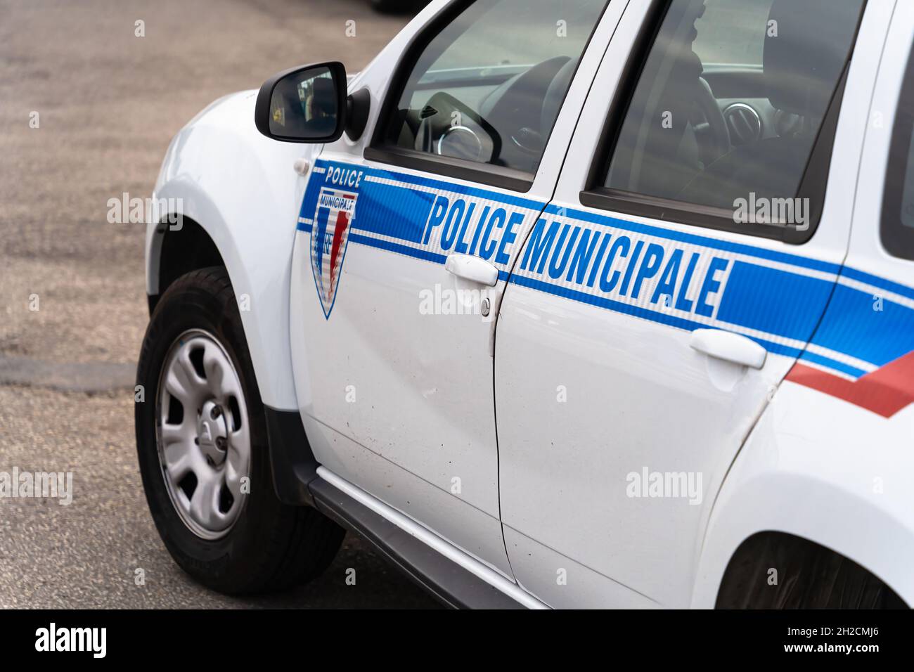 Honfleur, France - August 4, 2021: A white car of French Municipal police with french sign Police municipale. Stock Photo