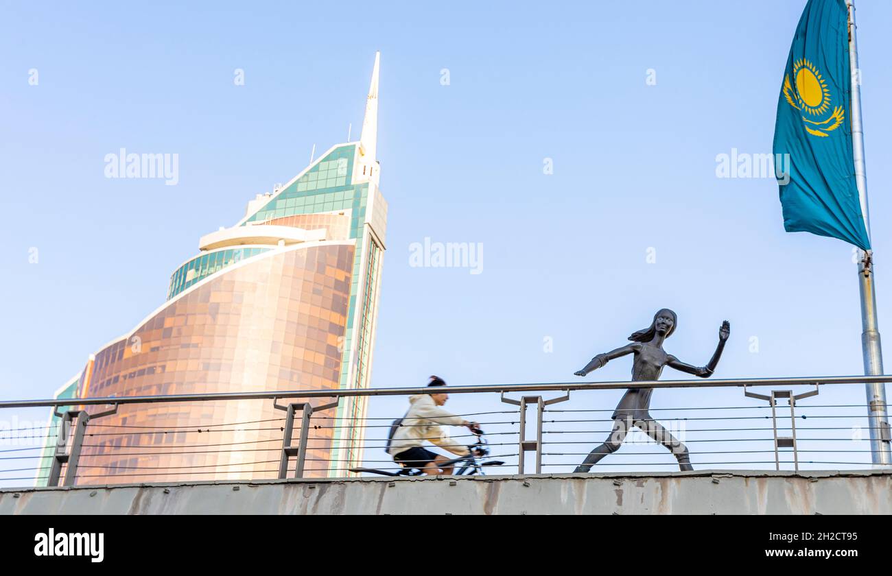Viaduct, Qabanbai Batyr ave, with sculpture of life-size running female sportsman, central location in Nur-Sultan, Astana, Kazakhstan Stock Photo