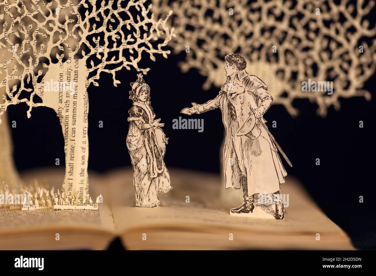 Book sculpture made from hand cut pages of Pride and Prejudice by Jane Austen incorporating the original antique book illustration. Stock Photo