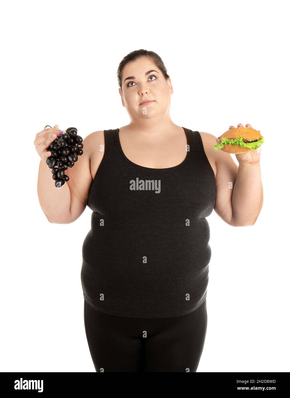 Photo inspiration: Overweight Woman With Hamburger And Grapes On White Background Stock Photo Inspiration