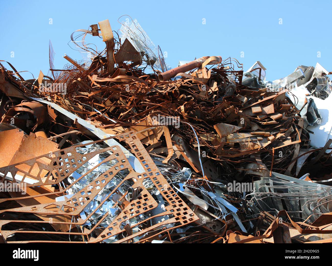 pile of many rusty ferrous scrap in a controlled landfill of a foundry Stock Photo