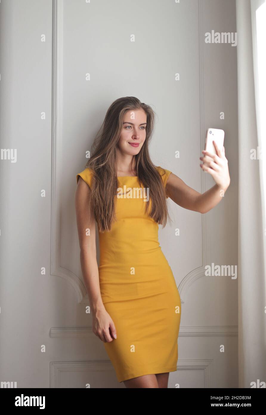 young woman takes a selfie at home Stock Photo - Alamy