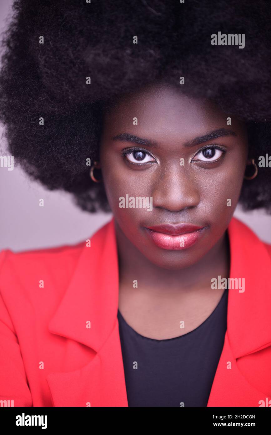 Beautiful young black woman with afro hair Stock Photo - Alamy