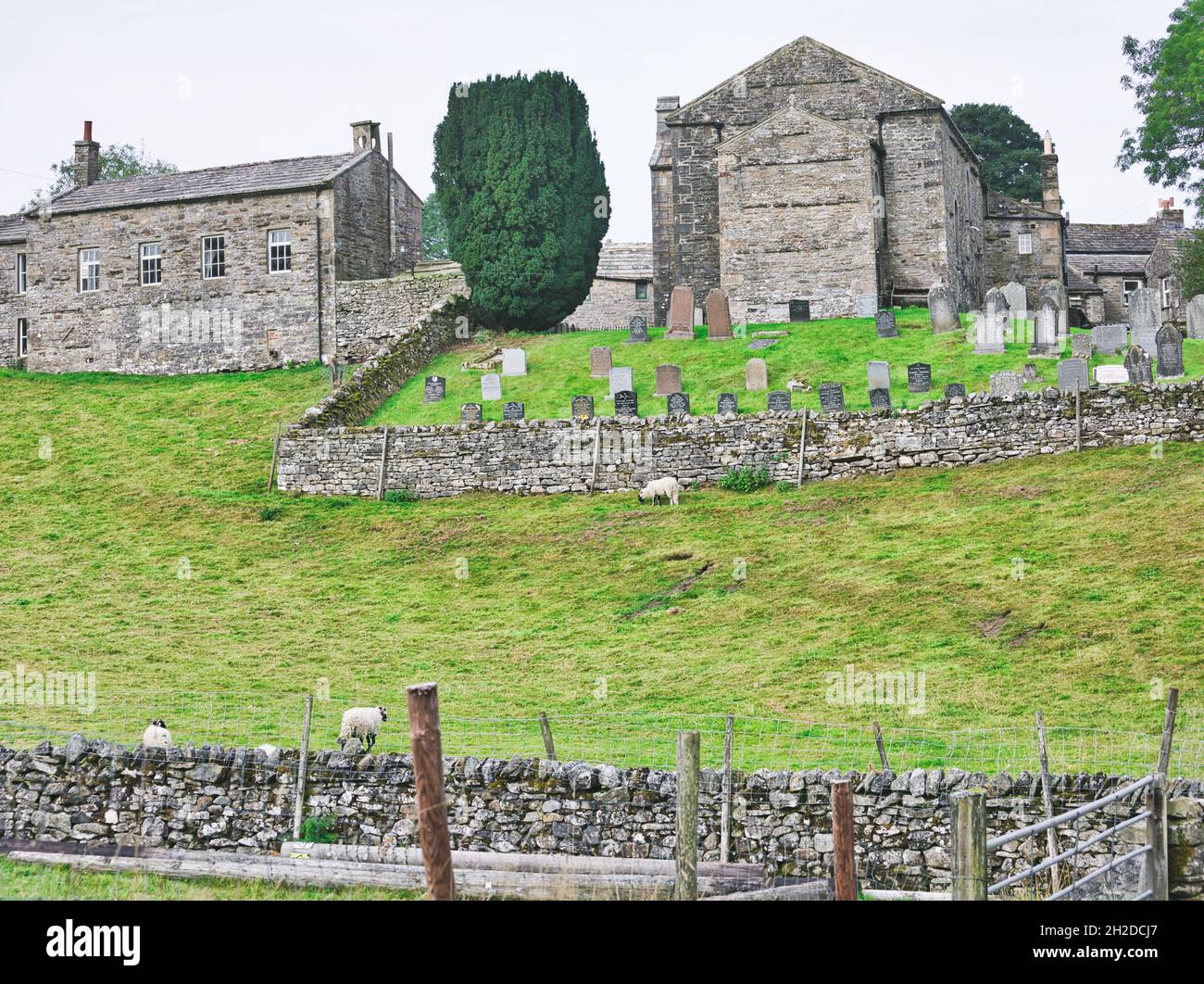 Keld United Reformed Church graveyard and dry stone walls in remote