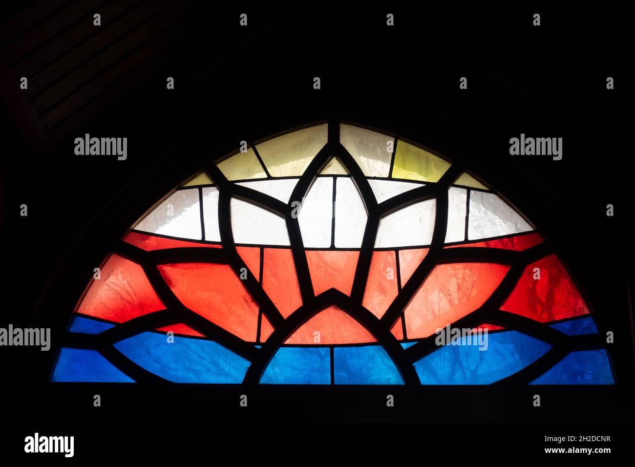 Closeup shot of the stained glass of a small window Stock Photo - Alamy