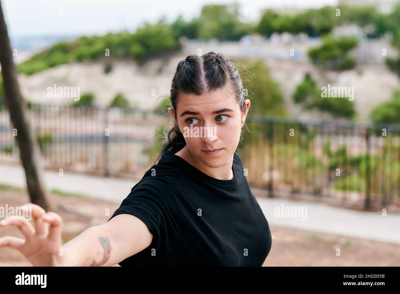 Portrait of a woman training martial arts in a park Stock Photo