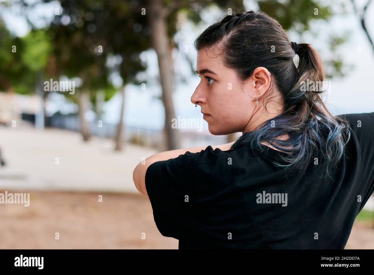Portrait of a woman training martial arts in a park Stock Photo