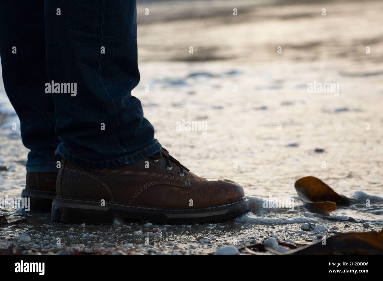 Boots By The Water Stock Photo Alamy