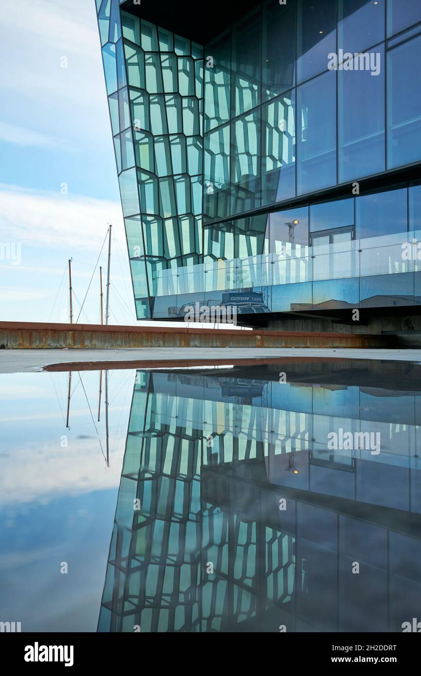 Part of contemporary building with glass transparent walls in futuristic style reflecting water of pool in Iceland Stock Photo