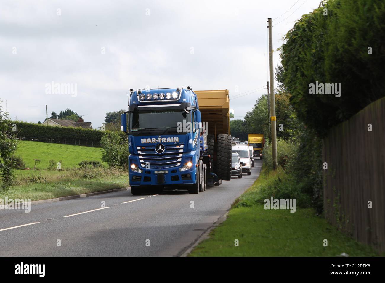 Martrain's Mercedes-Benz Actros LS 2.5 3363 G.space hauls a Caterpillar 775D dump truck near Lisburn, Northern Ireland Stock Photo