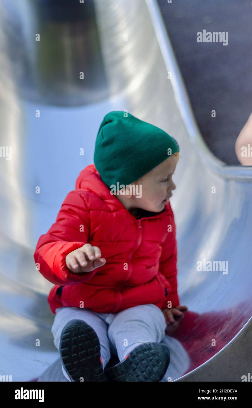 boy in red jacket going downhill Stock Photo Alamy