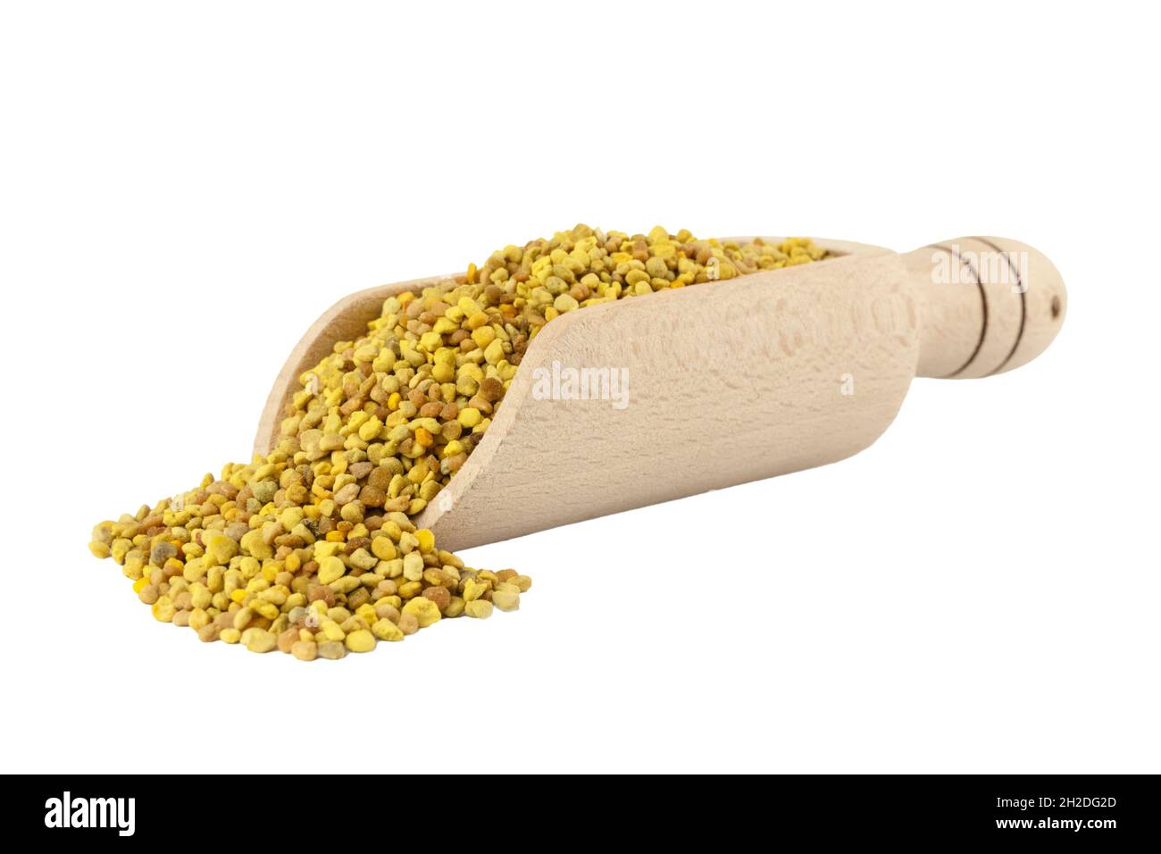 Bee pollen in wooden scoop isolated on white background. Natural herbal medicine to relieve inflammation, influenza, boosts liver health, strengthens Stock Photo