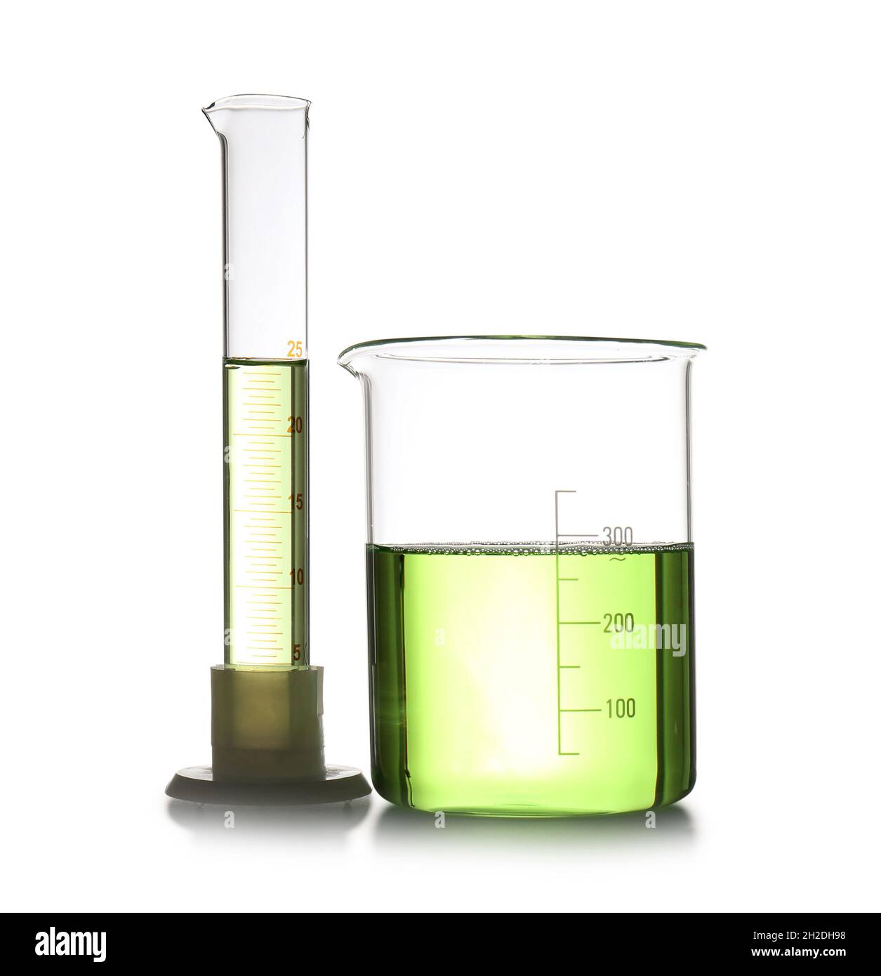 Chemistry laboratory glassware with samples isolated on white Stock