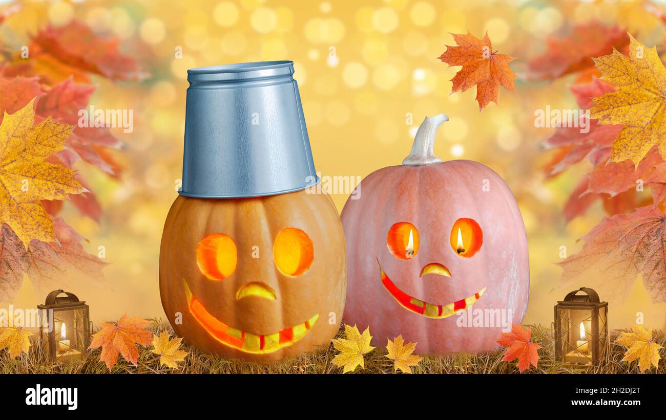 Funny Halloween pumpkins on a defocused autumn background Stock Photo