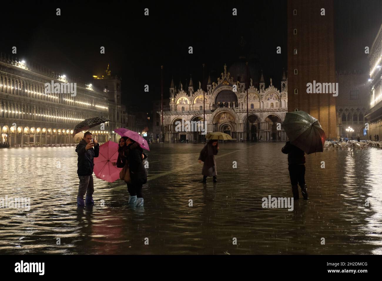 People walk in a flooded Saint Mark's Squere in Venice, Italy November 03, 2018.(MvS) Stock Photo