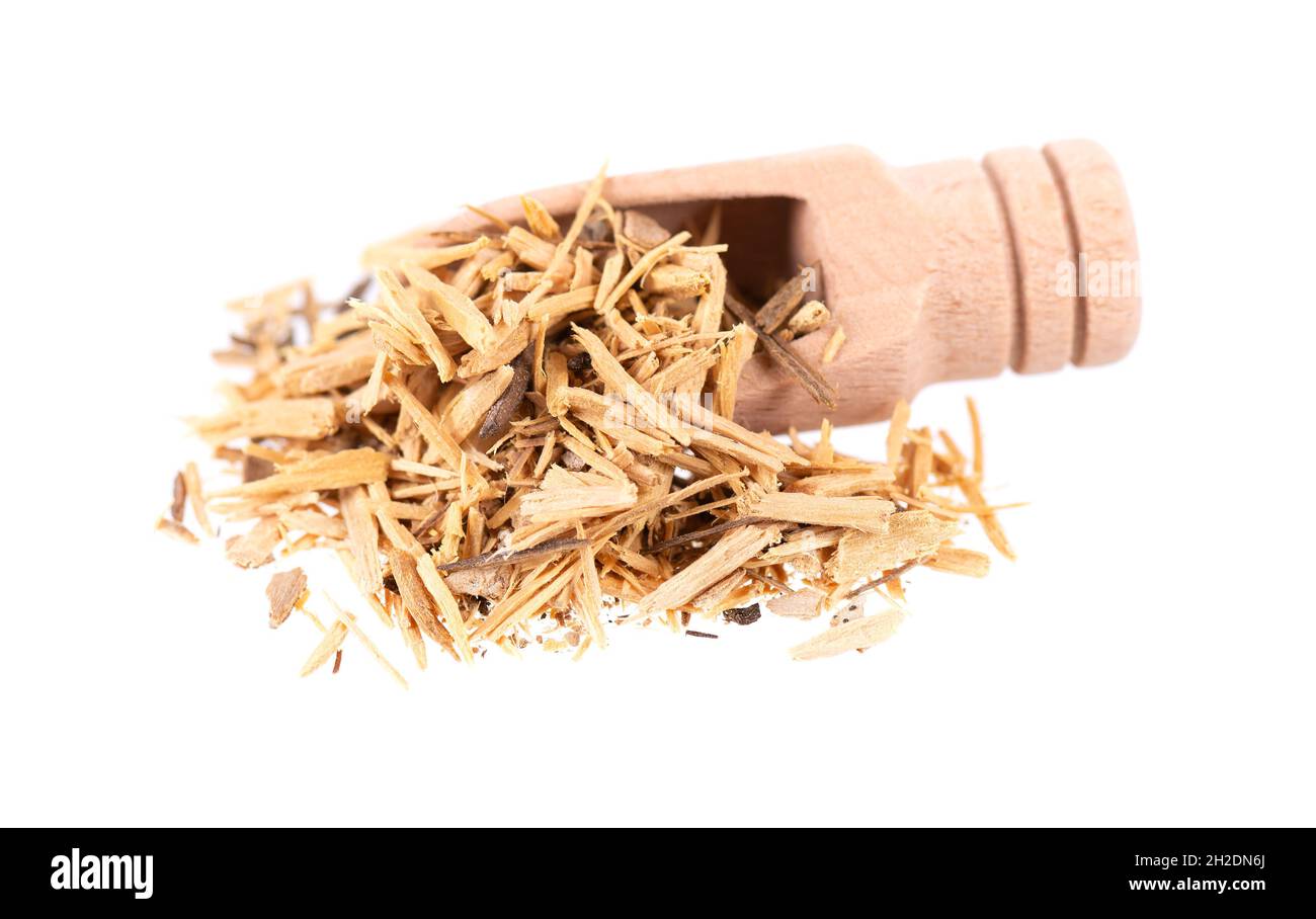 Muira Puama herbal tea in wooden scoop, isolated on white background. Natural potency wood