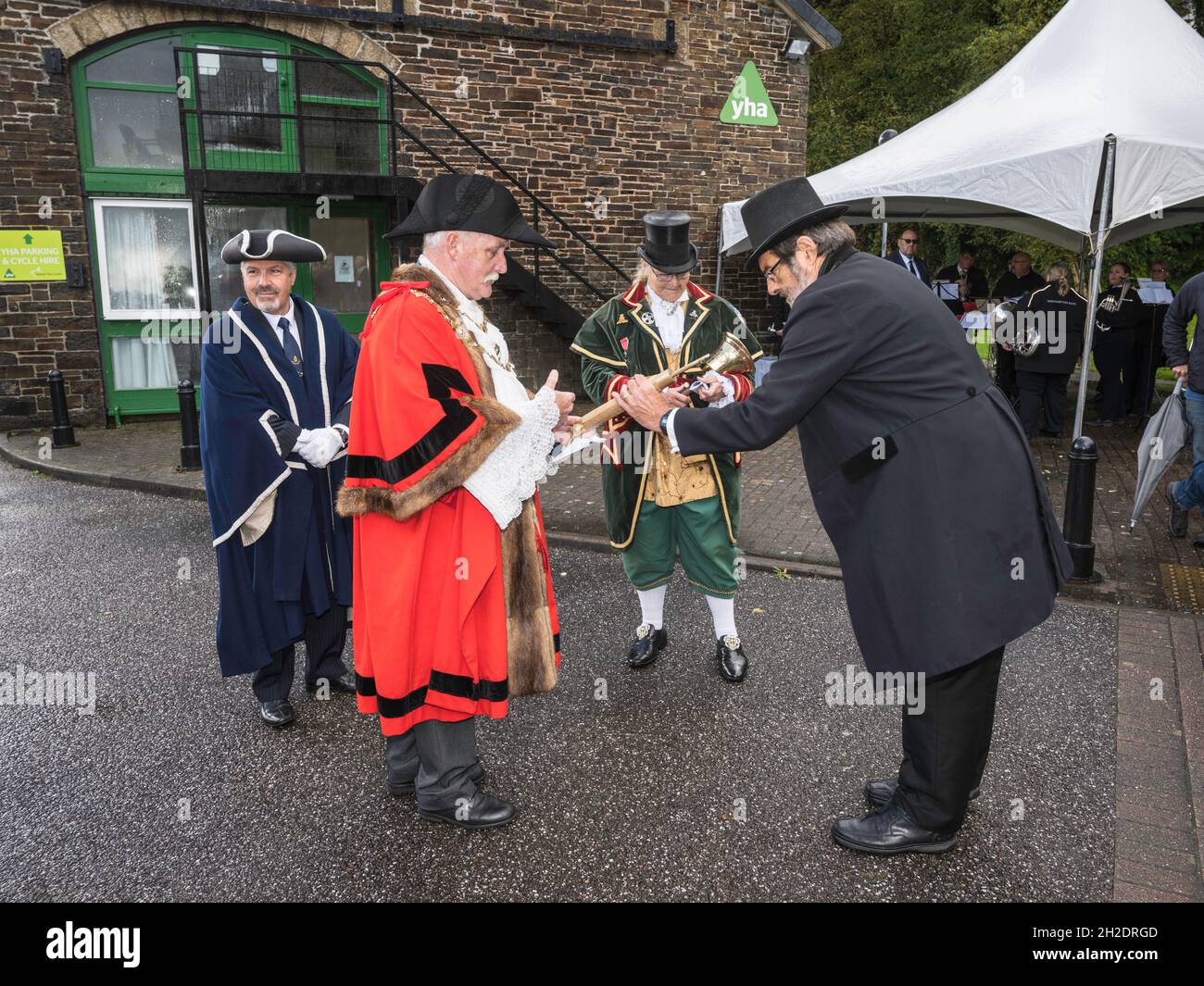 Costumed celebration marking 150 years of rail in Okehampton, Devon. Victorian stationmaster William Hodge accepts the key from mayor Bob Tolley. Stock Photo