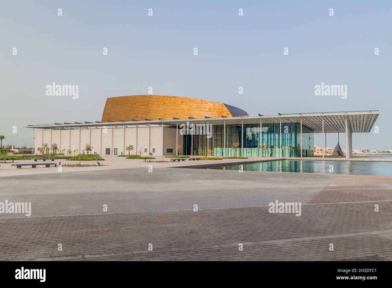 MANAMA, BAHRAIN - MARCH 15, 2017: National Theatre of Bahrain reflecting in a pond. Stock Photo