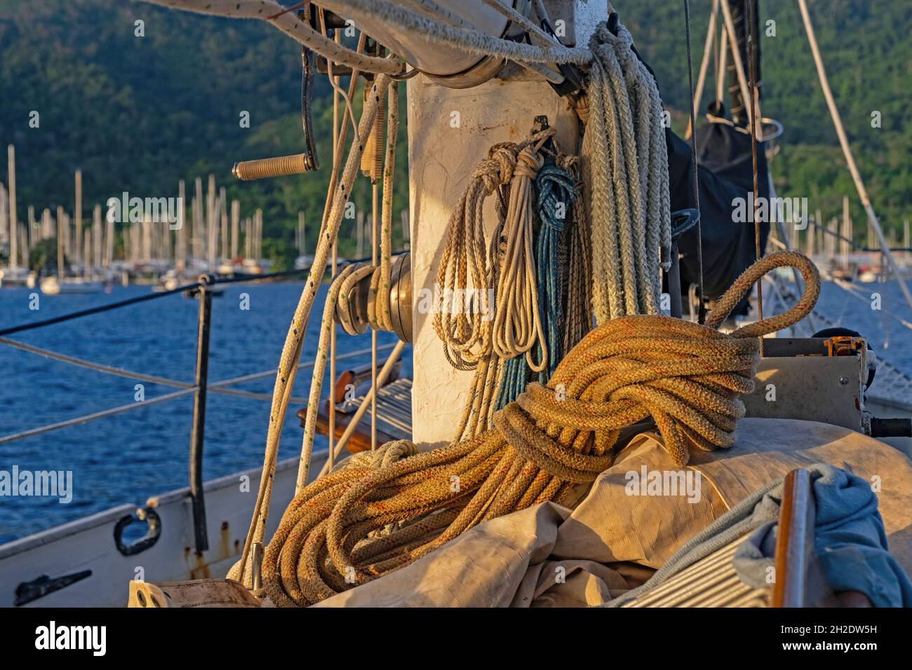 Coiled ropes on board of sailing boat / yacht in the harbour of Chaguaramas near Port of Spain, Trinidad and Tobago in the Caribbean Stock Photo