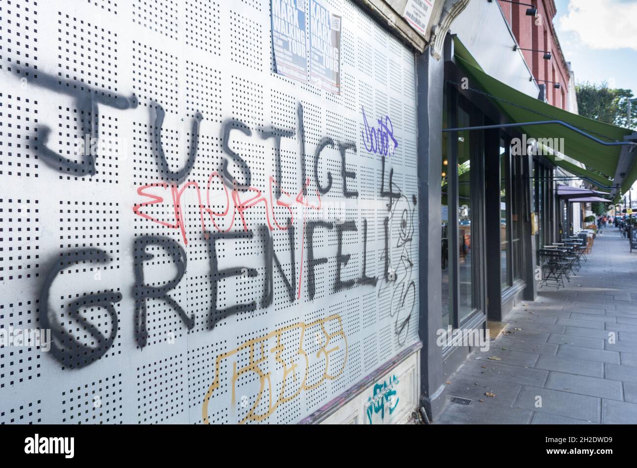 Justice for Grenfell graffiti on Westbourne Grove, London, England, UK Stock Photo