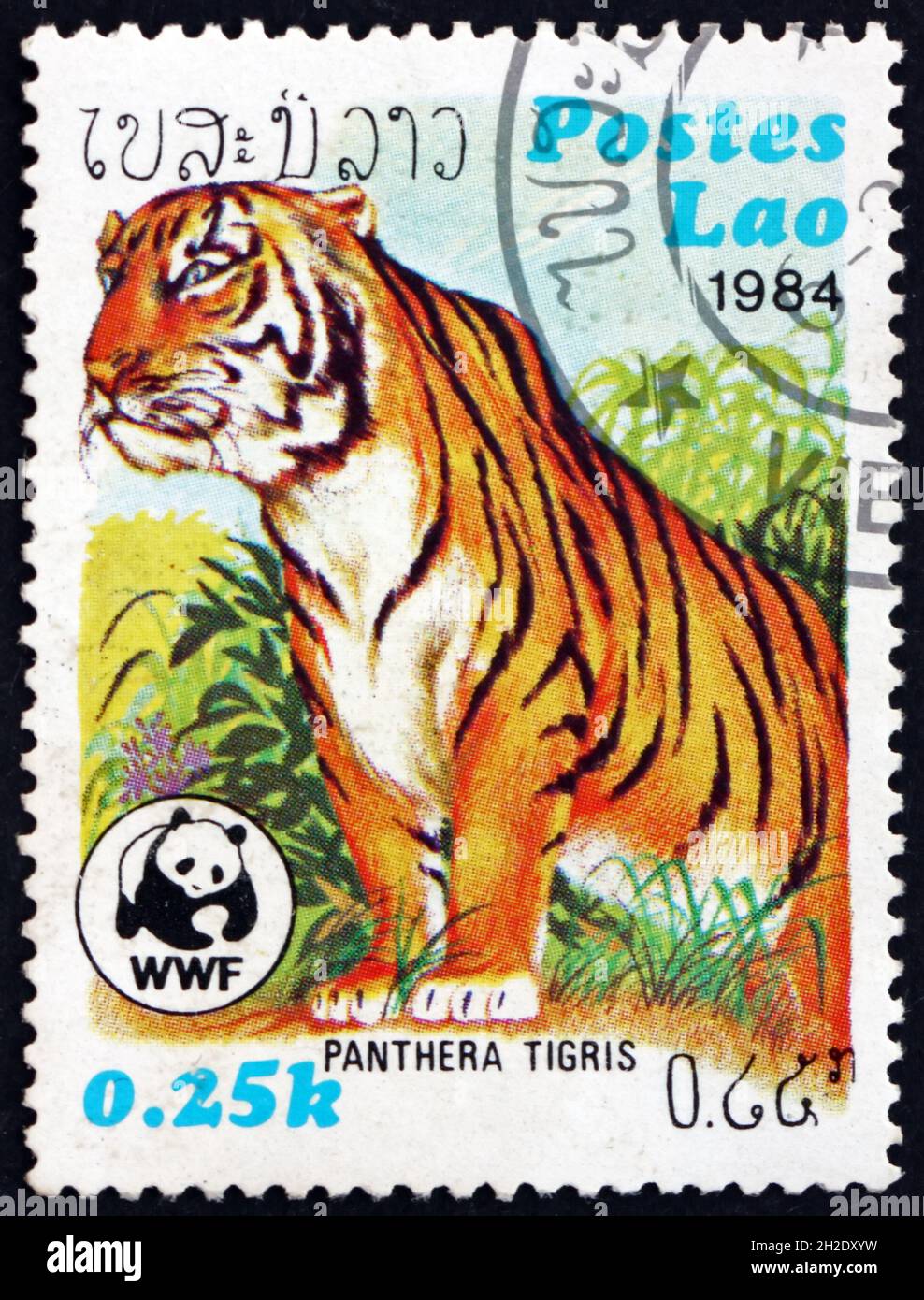 LAOS - CIRCA 1984: a stamp printed in Laos shows tiger, panthera tigris ...