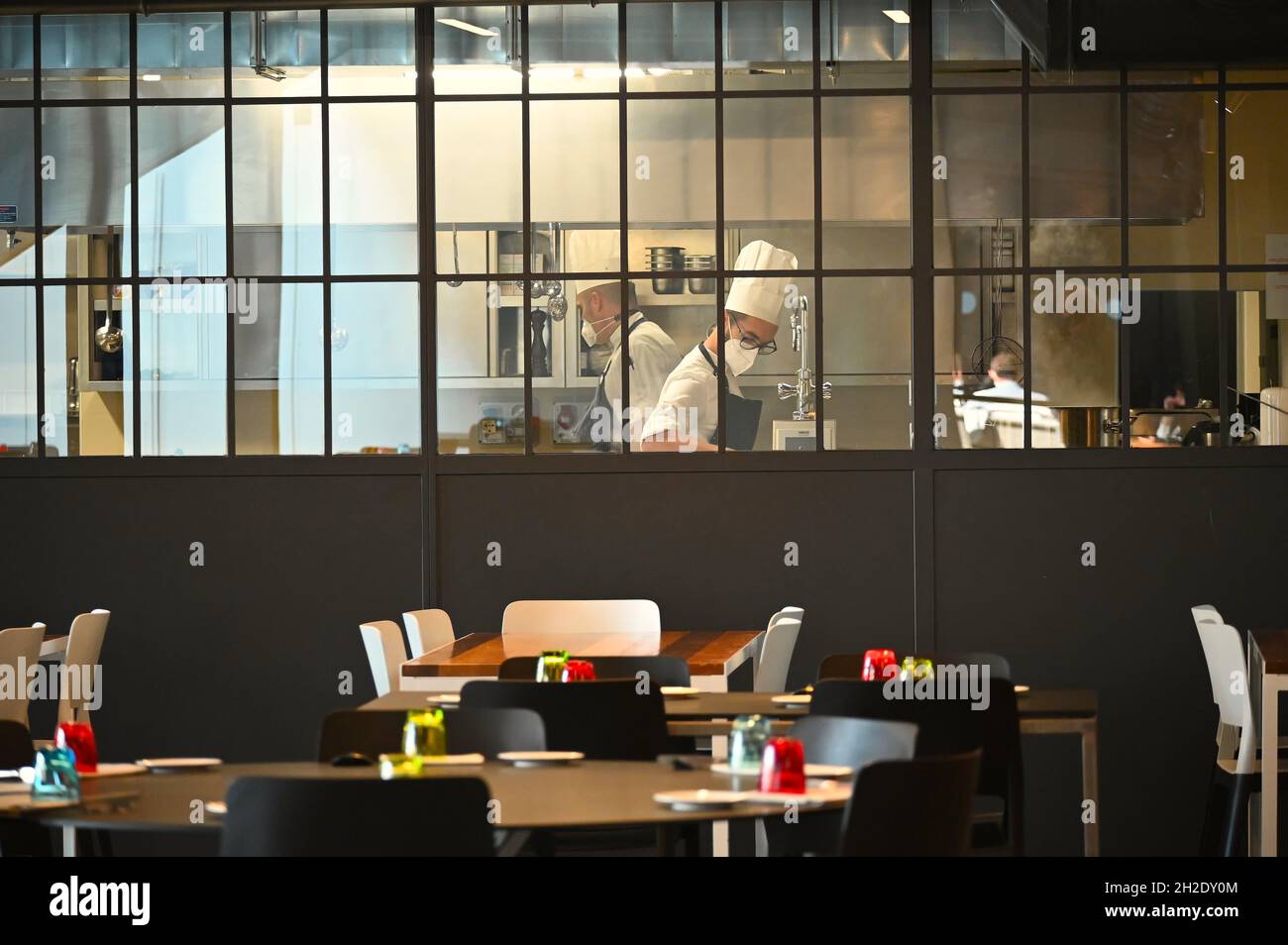 TURIN, ITALY - Sep 23, 2021: A beautiful restaurant interior with chefs ...