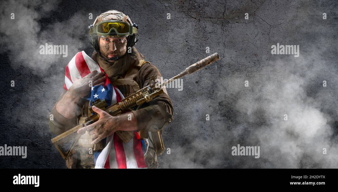 An American infantry soldier stands against the background of a ...