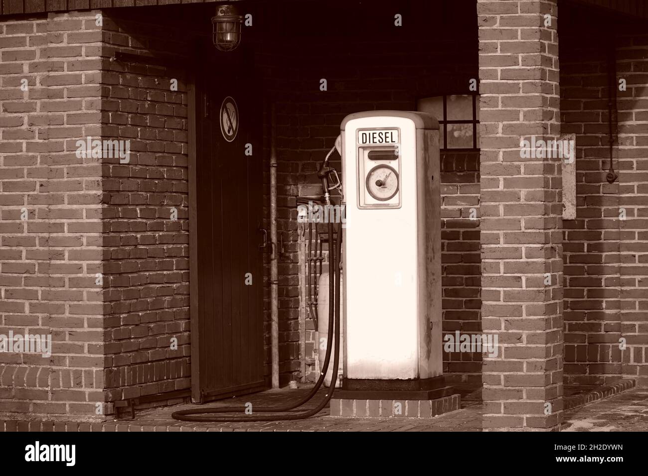 Old gasoline or diesel fuel pump at a gas station in a brick building, Bruchhausen Vilsen, Diepholz district, Lower Saxony, Germany. Stock Photo