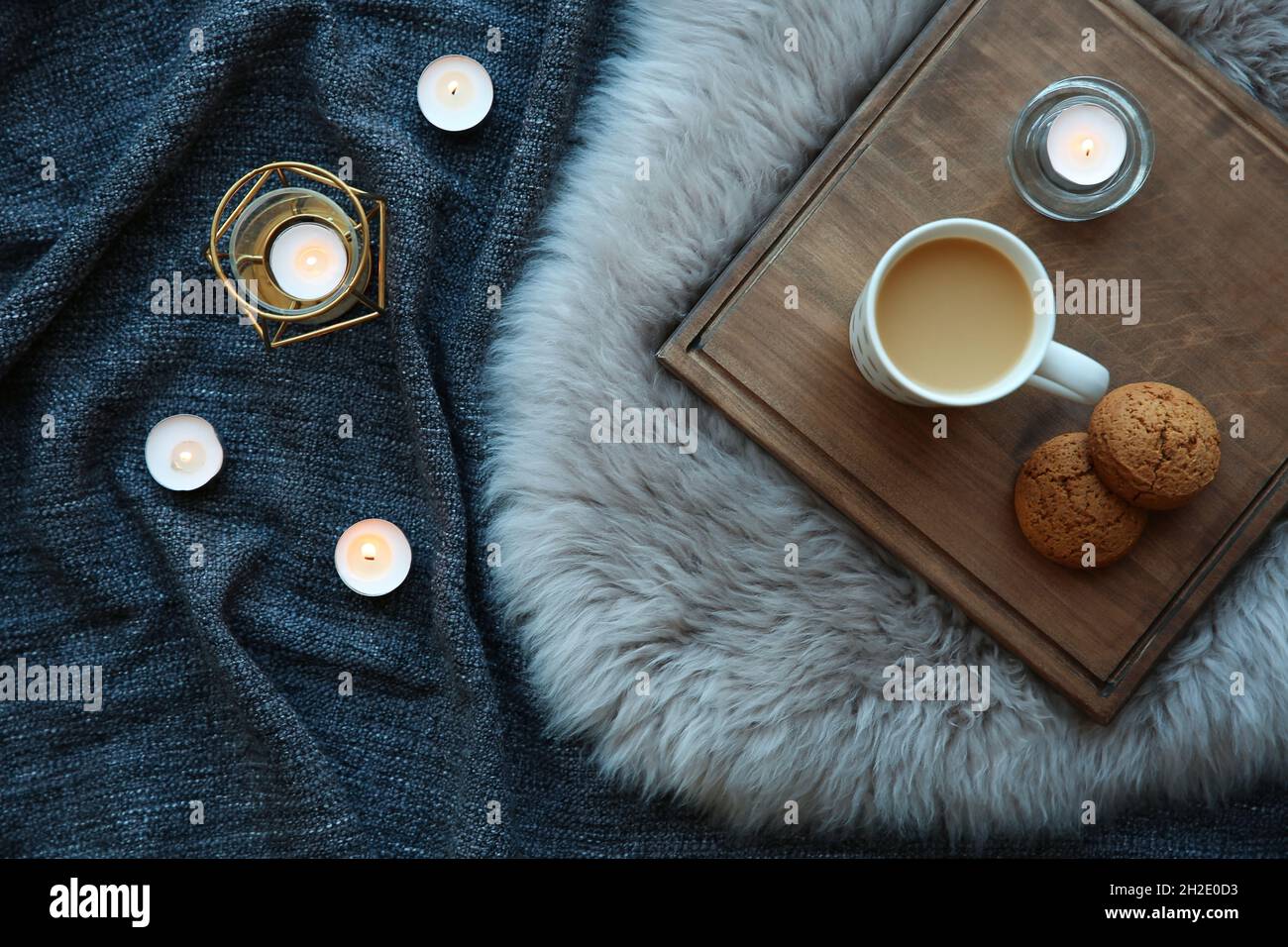 Flat lay composition with burning candles on fabric Stock Photo - Alamy