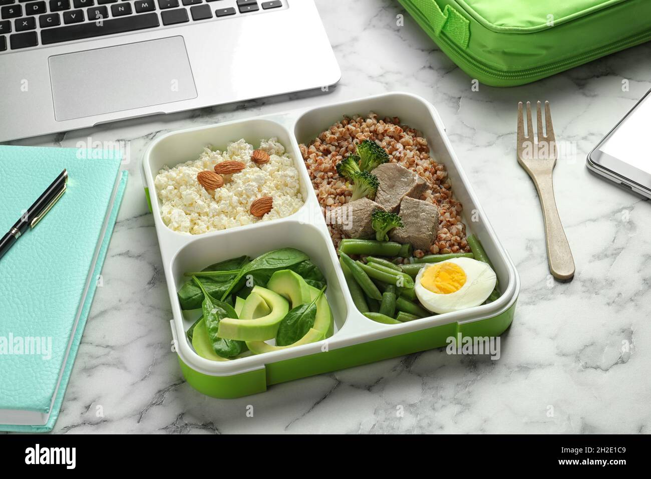 Container with natural protein food on office table Stock Photo Alamy