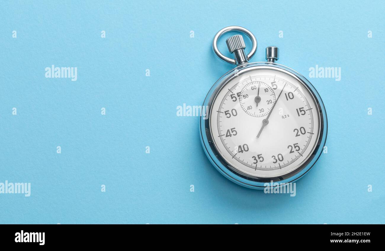 Stopwatch on blue background. Template Copy space for text. Stock Photo