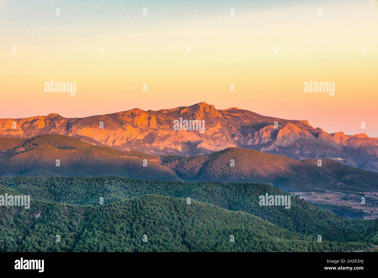 Morning over the wooded slopes of the Cabeco D'or mountains .Spain.Horizontal view. Stock Photo