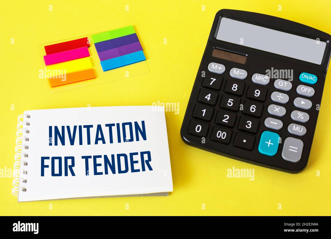 Writing text showing INVITATION TO BIDDER. Calculator, sticker on yellow background Stock Photo