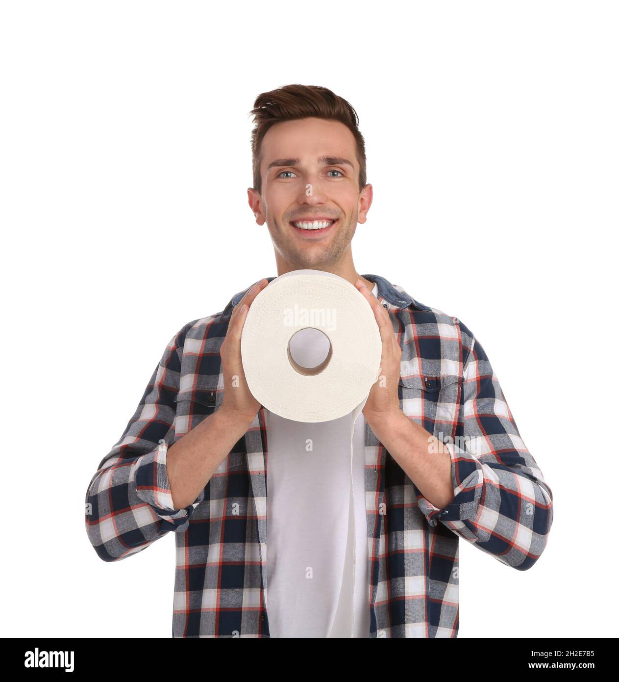 Young man holding toilet paper roll on white background Stock Photo Alamy