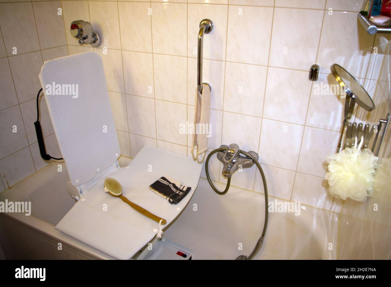 Bathroom with tub lift for disabled people Stock Photo Alamy