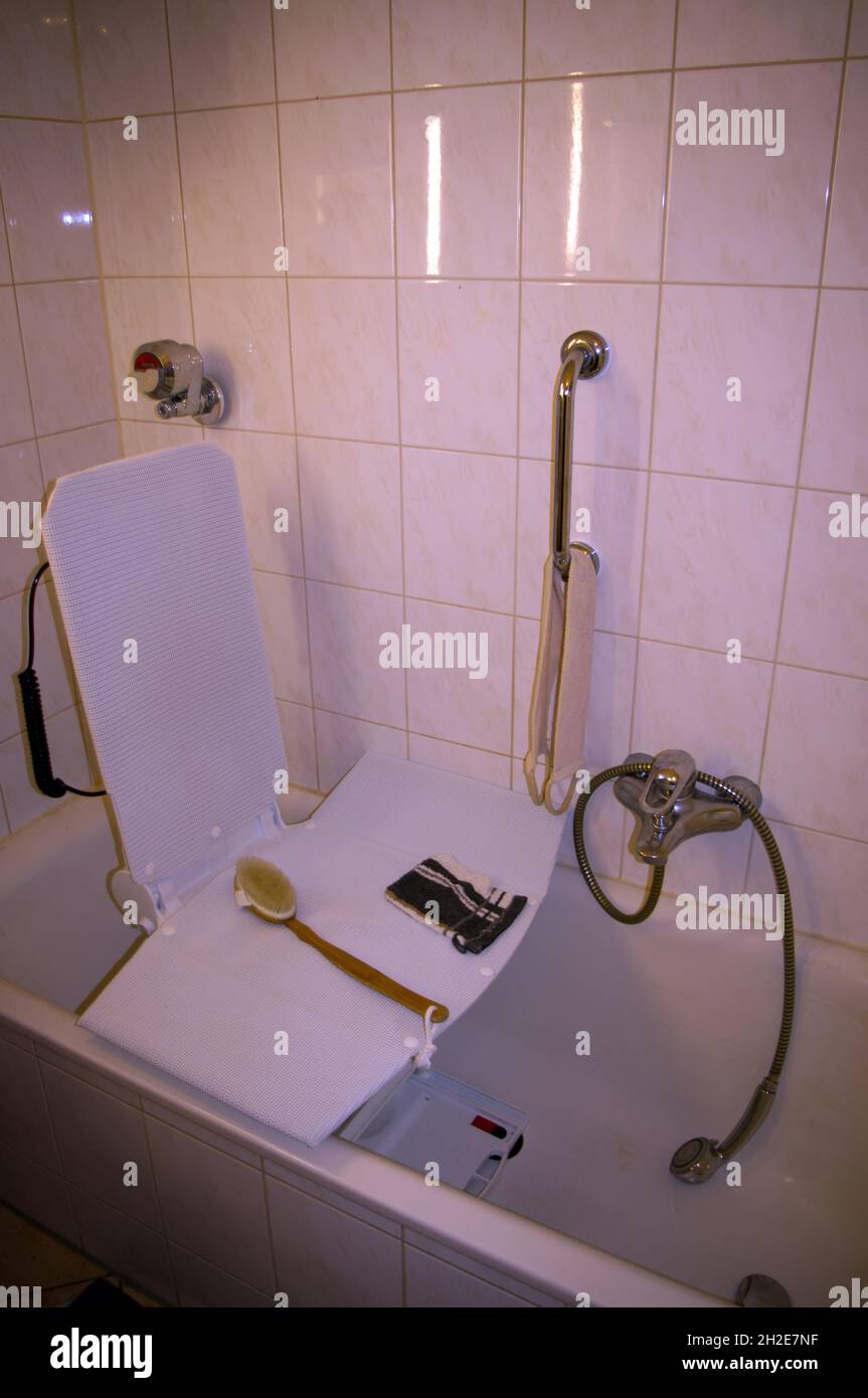 Bathroom with tub lift for disabled people Stock Photo Alamy