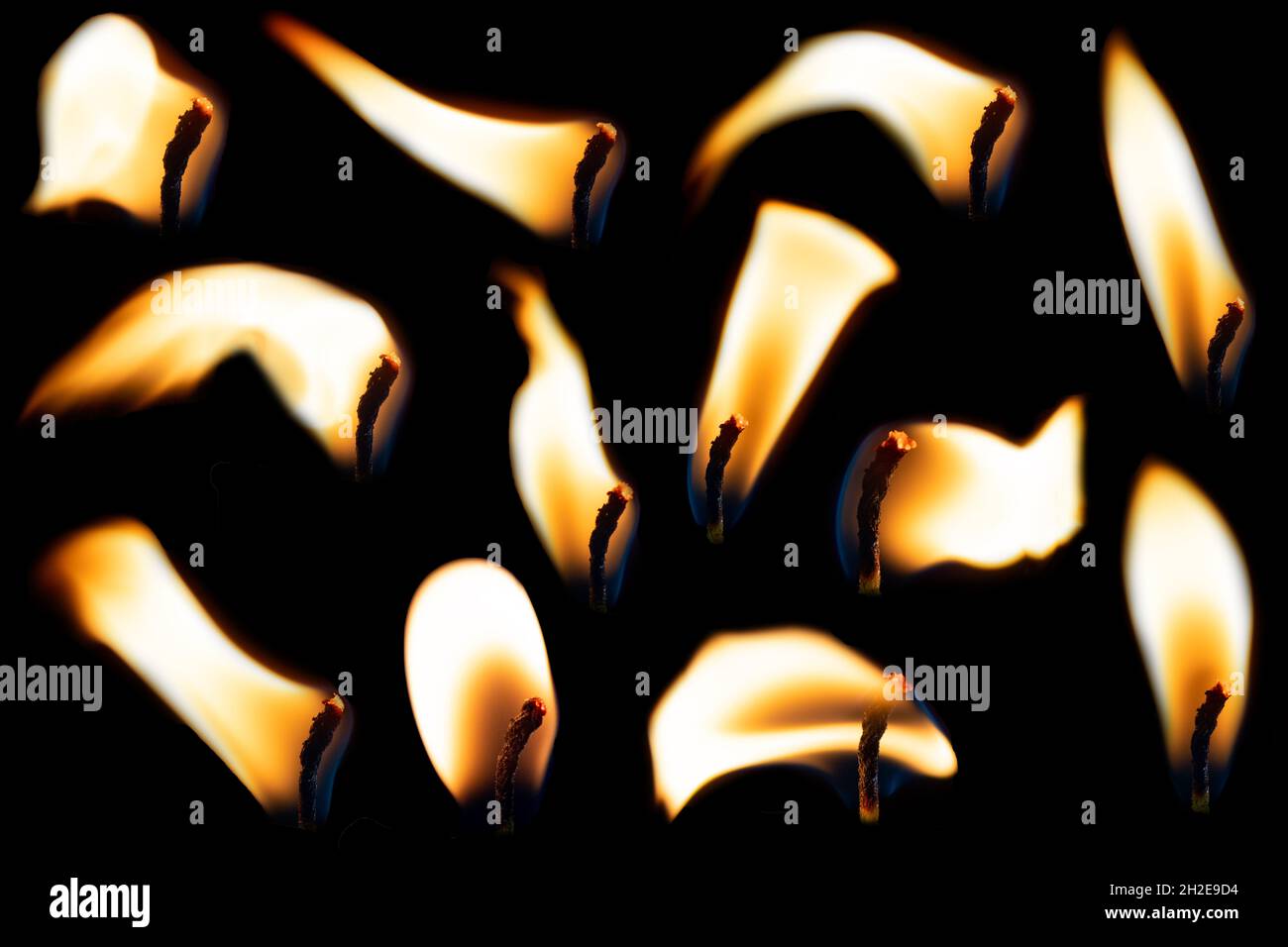 A set of candle flames on a black background, a collection of twelve images for your photos. The fire is burning, oppressive. Collection of fire and b Stock Photo