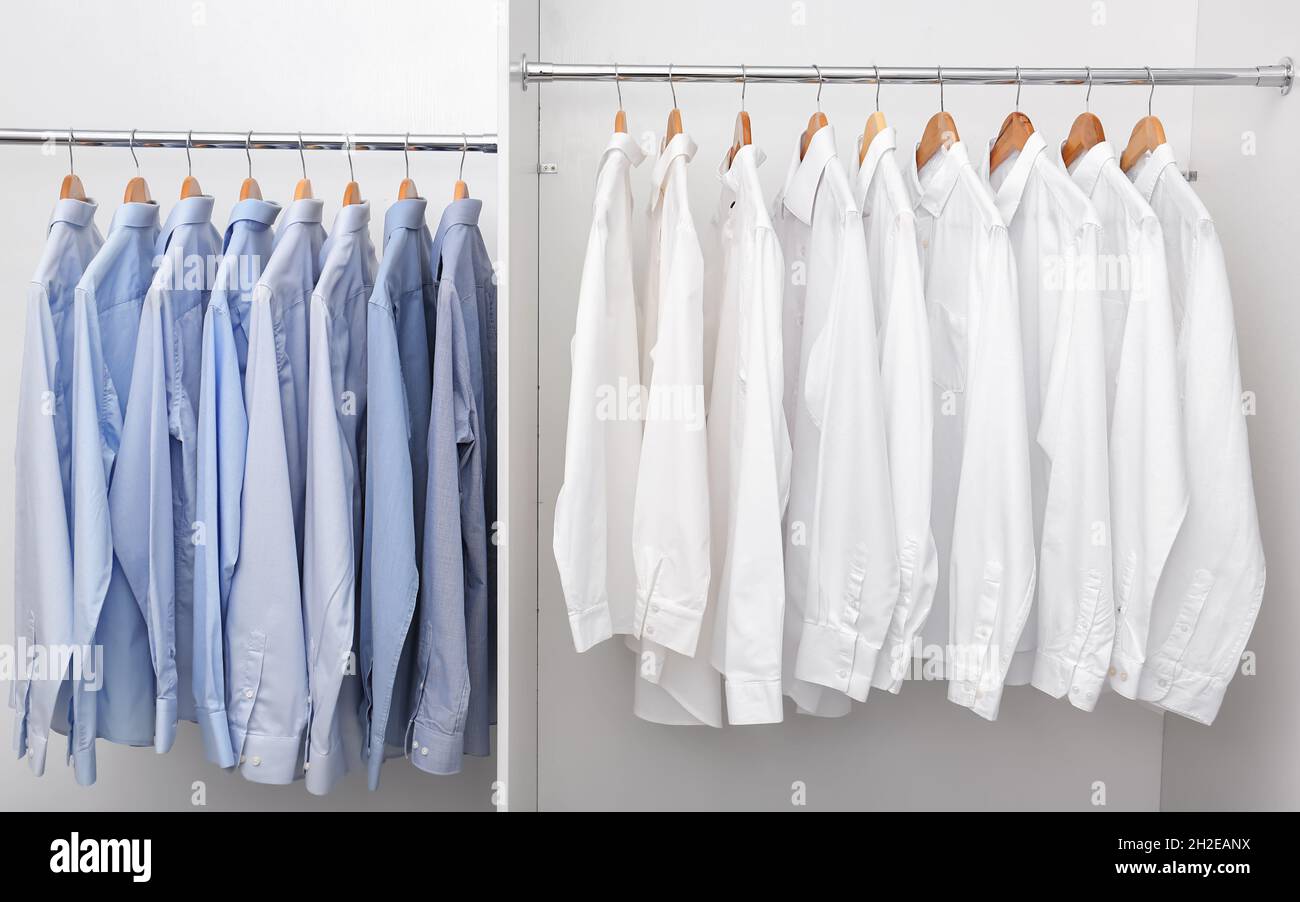 https://c8.alamy.com/comp/2H2EANX/racks-with-clean-clothes-after-dry-cleaning-on-hangers-in-wardrobe-2H2EANX.jpg