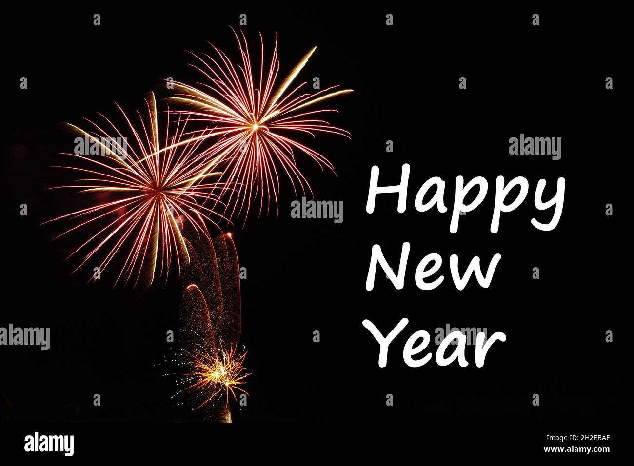 Happy New Year greeting with fireworks on black background Stock Photo ...