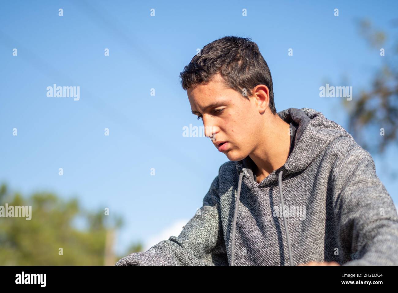 Half Body Shot Of Latin Teenage Boy With Black Hair Wearing Grey Sweater On A Sunny Day Stock Photo Alamy Half Body Shot Of Latin Teenage Boy With Black Hair Wearing Grey Sweater On A Sunny Day Stock Photo Alamy