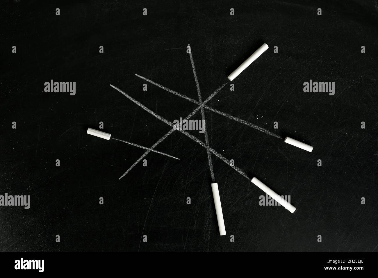 Chalk sticks on blackboard, closeup. School equipment Stock Photo Alamy