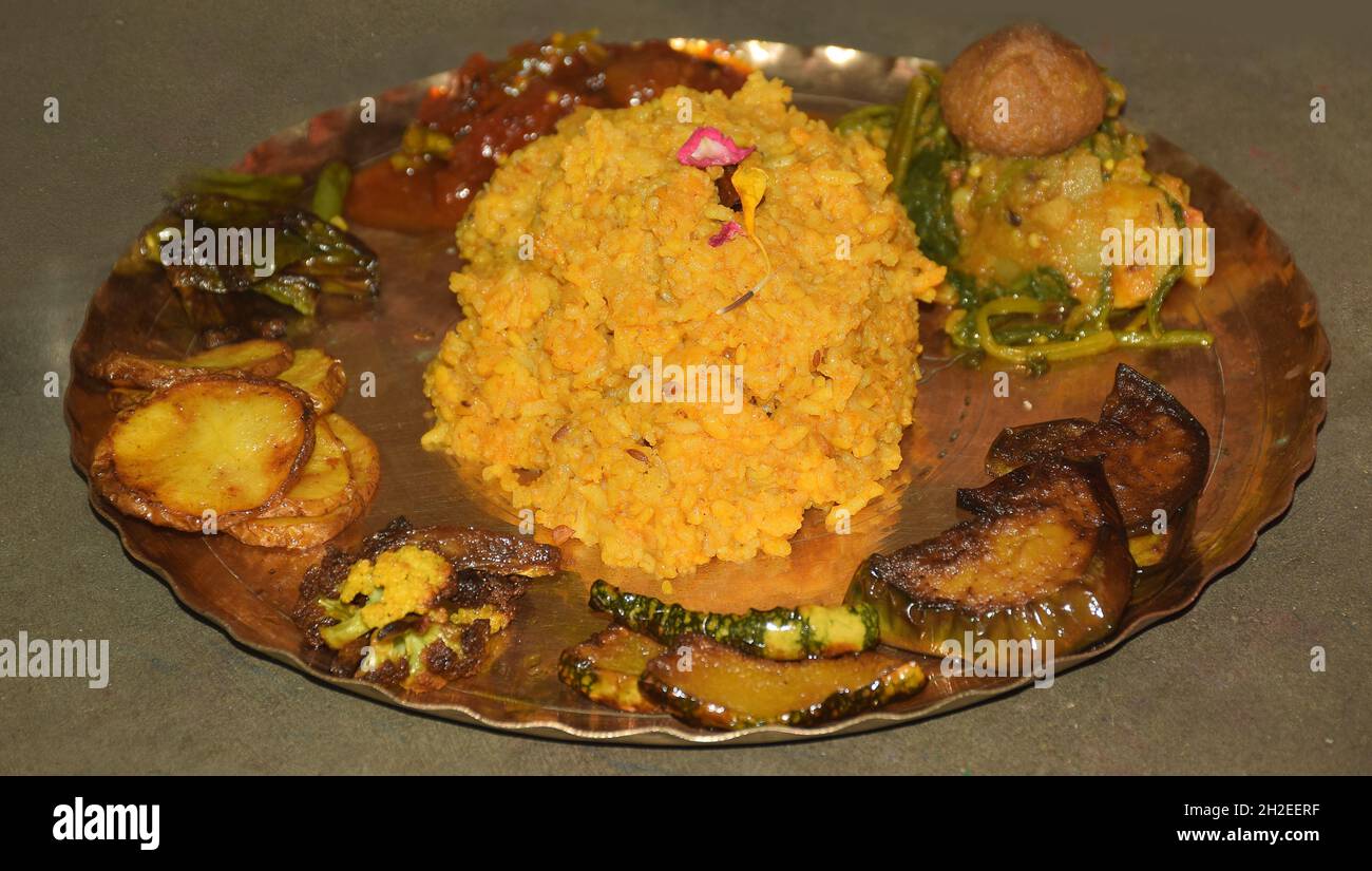 Traditional Bengali puja food offering to goddess lakshmi  during Laxmi puja festival . Goddess laxmi is also known as god of wealth. Bengali Khichdi Stock Photo