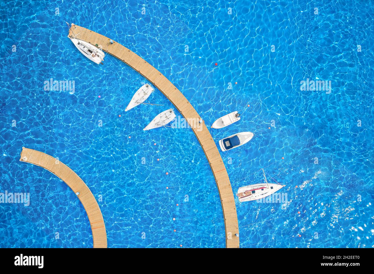 Top view of yacht club. White boats in sea water. Stock Photo