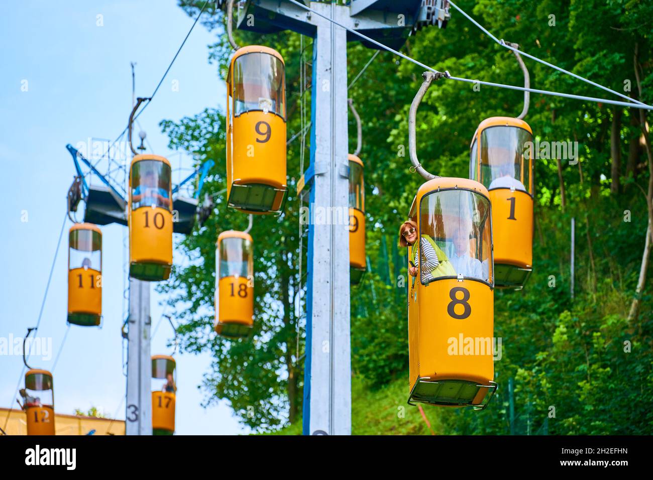 Svetlogorsk, Russia - 08.14.2021 - Cableway from green mountainside.  Svetlogorsk cable car with yellow cars. Fast aerial lift for tourists to  beach of Stock Photo - Alamy